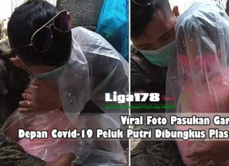 Viral Foto Pasukan Garda Depan Covid-19 Peluk Putri Dibungkus Plastik pria memeluk putrinya, Covid-19, wabah virus corona, Liga178 News